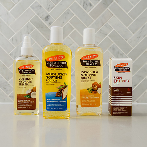 Palmer's body oil range pictured, Coconut, Cocoa Butter, Shea Butter and Skin Therapy Oil.